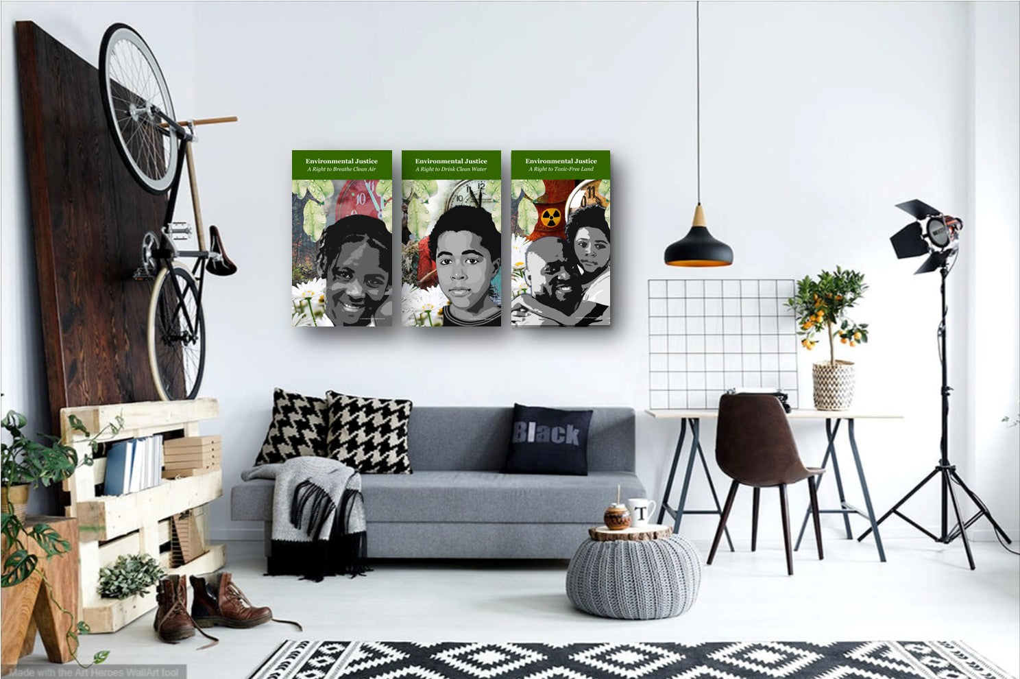 A living room setting with a sofa and three pillows. A black pendant light hangs from the ceiling. Three environmental justice posters are hung on the wall above the sofa. The poster focus on air, water and land pollution.